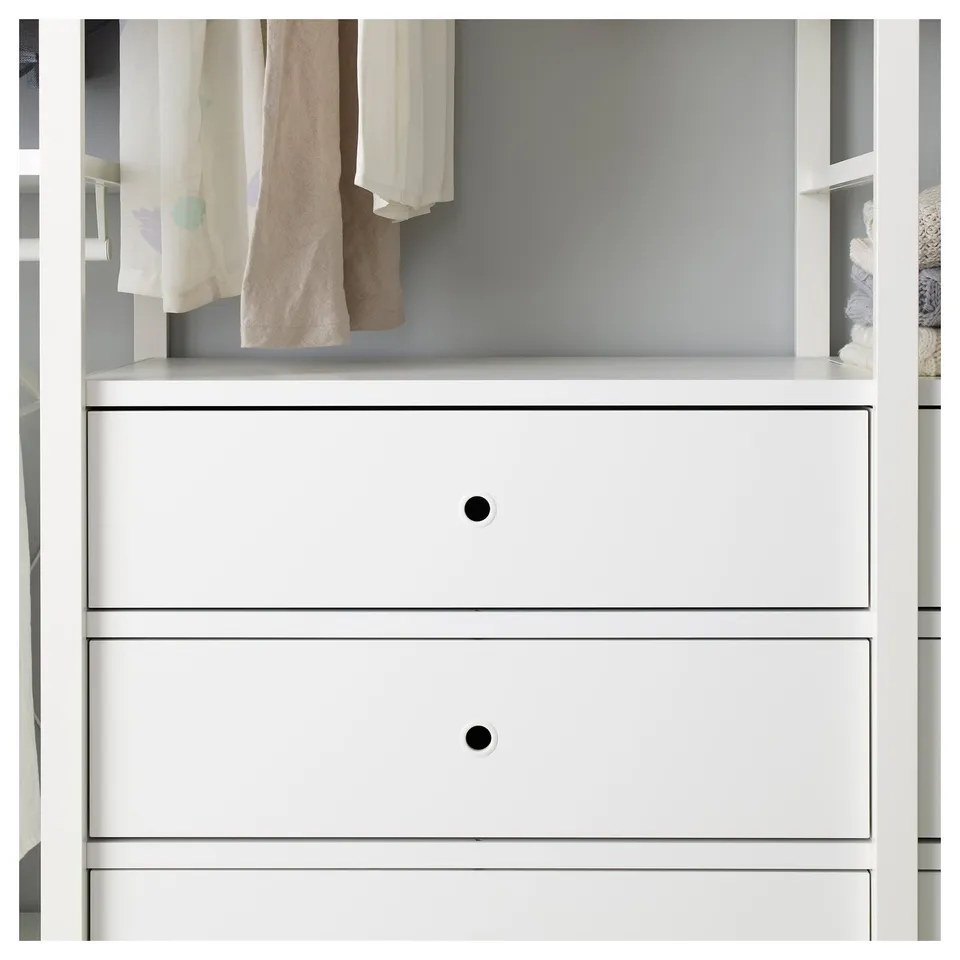 White drawers with black knobs, part of ELVARLI adjustable storage system.