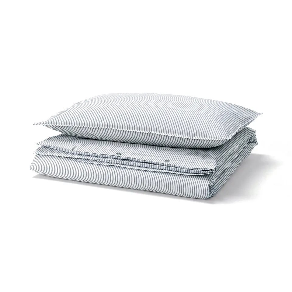 Two blue and white striped pillows stacked neatly.