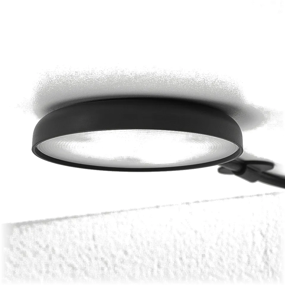 Modern, circular ceiling light, likely STRIMSÄV spotlight, emitting soft illumination, attached to ceiling.