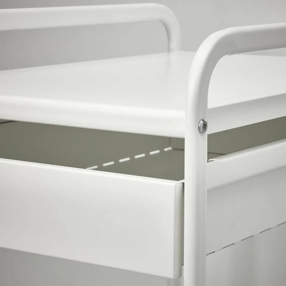Close-up of sturdy white metal shelving unit, showcasing clean lines and robust design.
